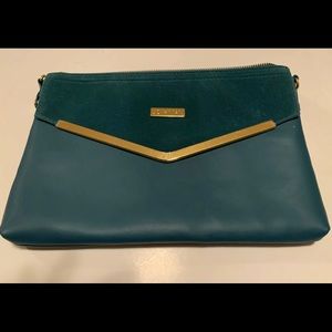 Joy and Iman teal clutch